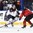 BUFFALO, NEW YORK - DECEMBER 27: Slovakia's Samuel Bucek #13 chips the puck past Canada's Cale Makar #7 during preliminary round action at the 2018 IIHF World Junior Championship. (Photo by Matt Zambonin/HHOF-IIHF Images)

